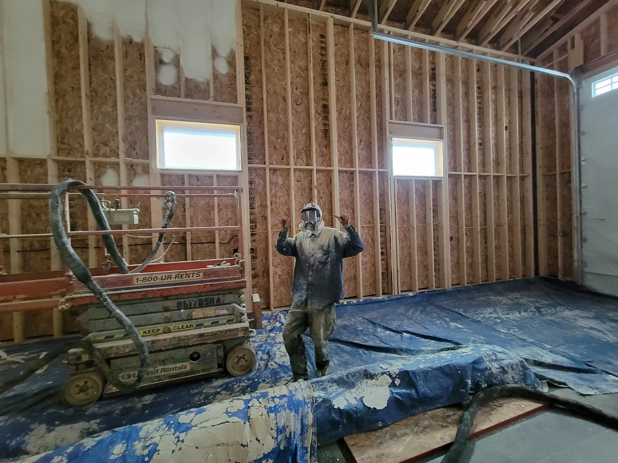 Spray foam installed along a roof assembly